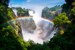 © Gary Arndt - Rainbow over waterfalls