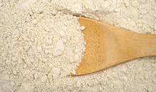 Close View Of Caramel Cake Mix With Wood Spoon