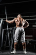 © romanolebedev - strong and handsome young man doing exercise with dumbbells