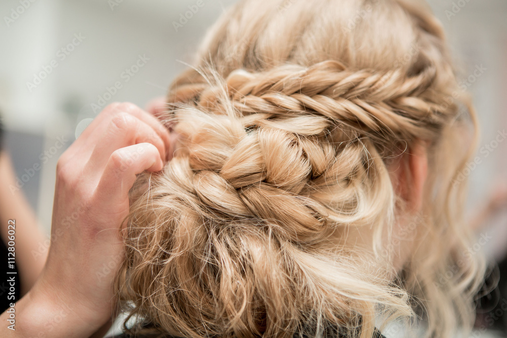 Application of wedding makeup. Preparation of the bride. Boho style. Ease of braided hair braids. - obrazy, fototapety, plakaty 