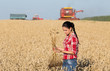 Farmer girl in wheat field