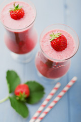 Wall Mural - Delicious strawberry smoothie with milk, prepared with fresh str