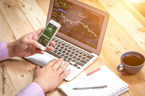 Fotografía Business broker analyzing stock market diagrams on the digital t