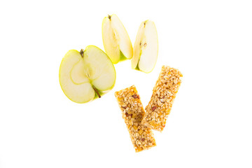 muesli bars dried fruit on isolated background with apple