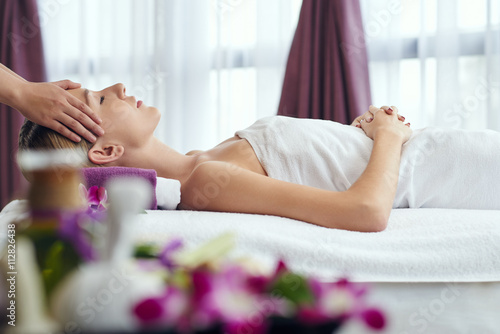 Fotografie, Obraz Woman receiving relaxing head massage in spa salon