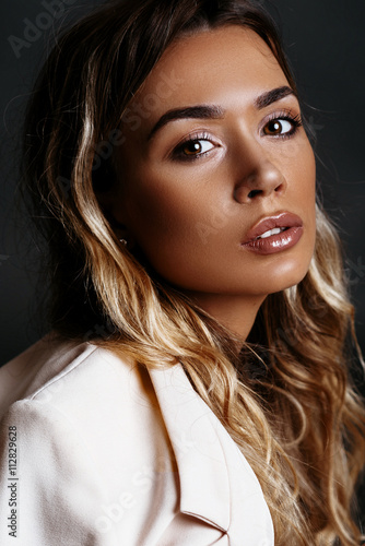 Beautiful Sexy Blonde Girl With Bronze Tan In A White Coat And