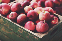 Ripe Apples In Rustic Wooden Crate