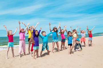 Wall Mural - Active happy children on the beach