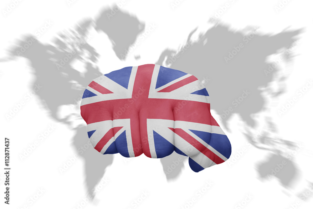 fist with the national flag of great britain on a world map background ...
