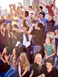 © Gennadiy Poznyakov - Sport fans hands up and singing on tribunes. Group people in sport.