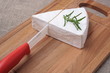 © sergeylapin - brie cheese and knife on wooden
