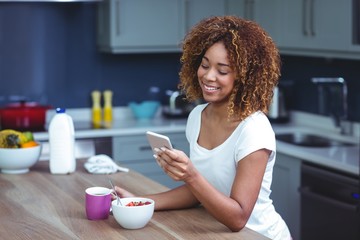 Happy woman using smartphone 