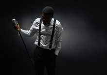 Male Singer Posing Over Dark Background