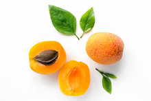 Fresh Whole And Sliced Apricot With Leaves. Isolated. White Background