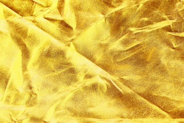 Gold background or texture and shadow. Gold fabric crease