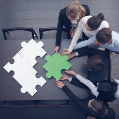 Wall Mural - Business people assembling puzzle