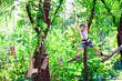© davit85 - adventure climbing high wire park - people on course in mountain