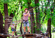 © davit85 - adventure climbing high wire park - people on course in mountain