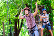 © davit85 - adventure climbing high wire park - people on course in mountain