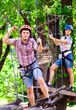 © davit85 - adventure climbing high wire park - people on course in mountain