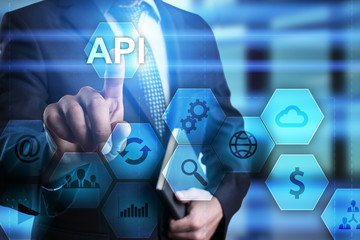 businessman pressing button on touch screen interface and select api. busines concept.