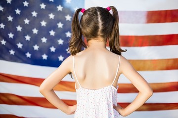 young girl standing with hands on hip