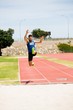 © WavebreakMediaMicro - Athlete performing a long jump