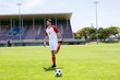 © WavebreakMediaMicro - Football player warming up in stadium