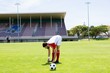 © WavebreakMediaMicro - Football player warming up in stadium
