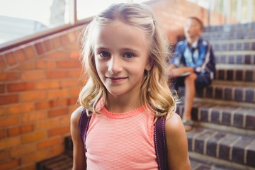 cute little blonde girl looking at the camera