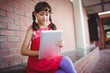 © WavebreakmediaMicro - Girl sitting on a wall looking