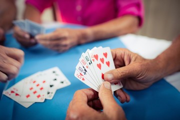 Group of seniors playing cards