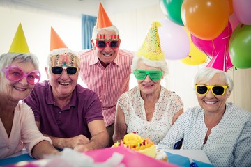Wall Mural - group of seniors celebrating a birthday