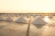 Heap of sea salt in salt farm during sunset in Thailand.
