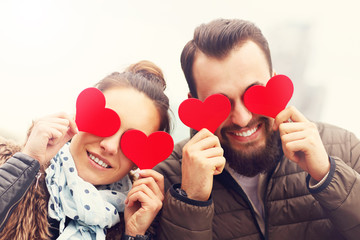 Romantic couple holding hearts