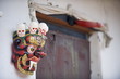 © robertharding - Mask and phallus hanging on a door to protect its occupants, near the temple of the Divine Madman, Metshina, Punakha, Bhutan
