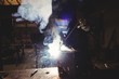 © Wavebreak Media - Welder cutting metal