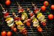 Grilled vegetable and meat skewers in a herb marinade on a grill pan, top view