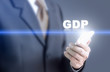 © sitthiphong - Businessman pressing hand gdp message on virtual screen. Can bring to the medium of your ad.