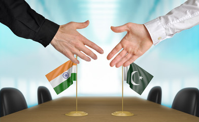 Wall Mural - India and Pakistan diplomats shaking hands to agree deal, part 3D rendering