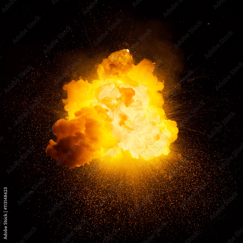 Realistic fiery explosion over a black background - obrazy, fototapety, plakaty 