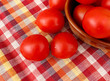 Red tomatoes scattered on the table