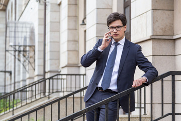 Canvas Print - Young handsome businessman on phone