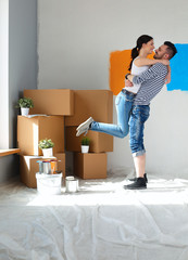 Happy young couple moving in new house