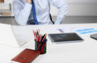 © v_l - Business man sitting on the desk and working in his office