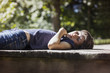 © Cavan Images - Boy relaxing on porch