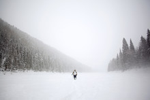 Ice Fisherman Walking In Snow