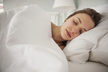 Young Woman Sleeping In Bed