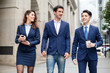 © leungchopan - Group of business people discuss at outdoor