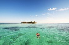 Man Snorkeling Near Tropical Island